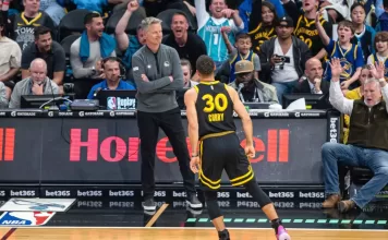 Steve Kerr reacts after spotting his doppelganger in the stands