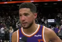 Devin Booker reacts to Steph Curry wearing his shoes